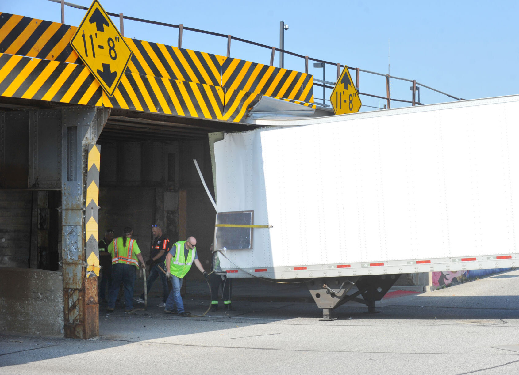 Truck-eating bridge snacks on semitrailer